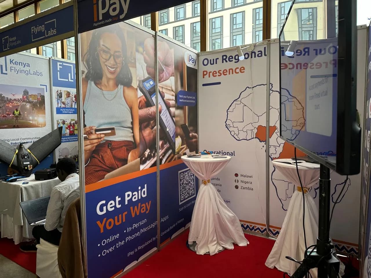 iPay booth with 'Get Paid Your Way' graphics
